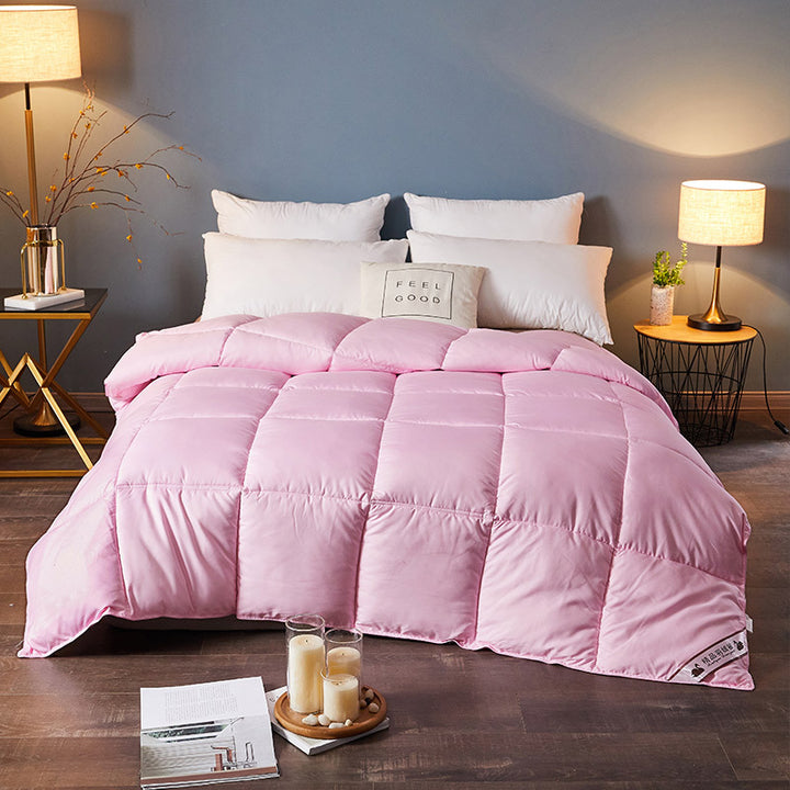 Quilted winter duvet on a bed